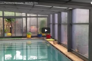 video copertura piscina addossata modello oro 600x400 1